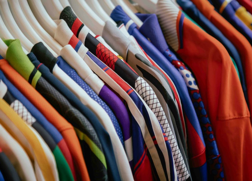 Screen printing press and sublimated performance apparel compared