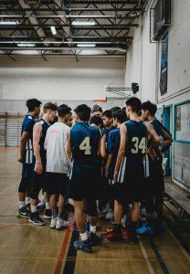 Youth sports team wearing matching custom apparel from a team online stor